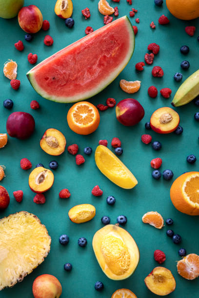 istock Tropical fruits on a blue background, flat lay. 1401407119