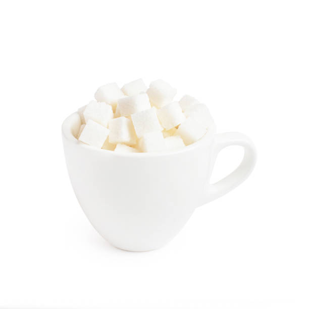 istock white mug for coffee with sugar cubes on a white isolated background 1401407163