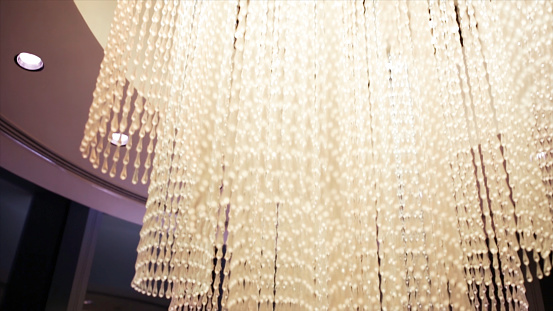 Beautiful Chandelier Lighting Crystal. Stock. High chandelier in a luxury hotel.