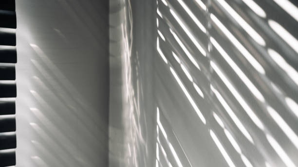 istock Lights shadows. Abstract light, black shadow overlay from window on white texture wall. Sunlight architecture background. Textures Light reflection from the window. 1401410951