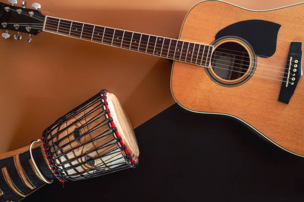 istock Flat lay, music background with acoustic guitar and drum. 1401411176