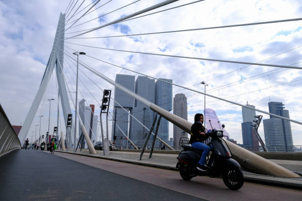A man rides an electric scooter in Rotterdam, Netherlands on September 25, 2021.