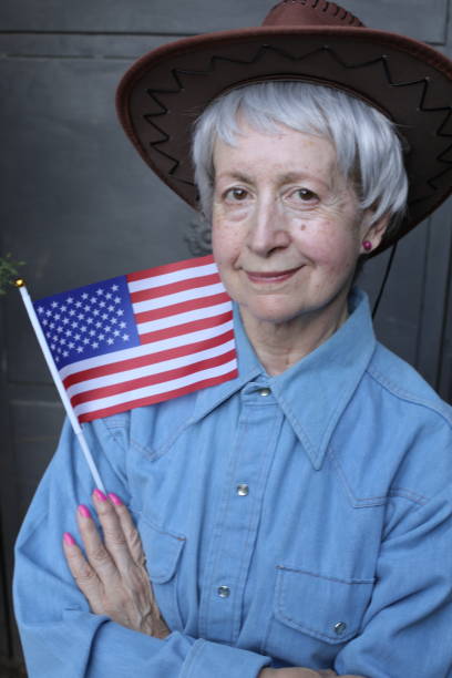 istock Woman wearing holding the American flag 1401414021