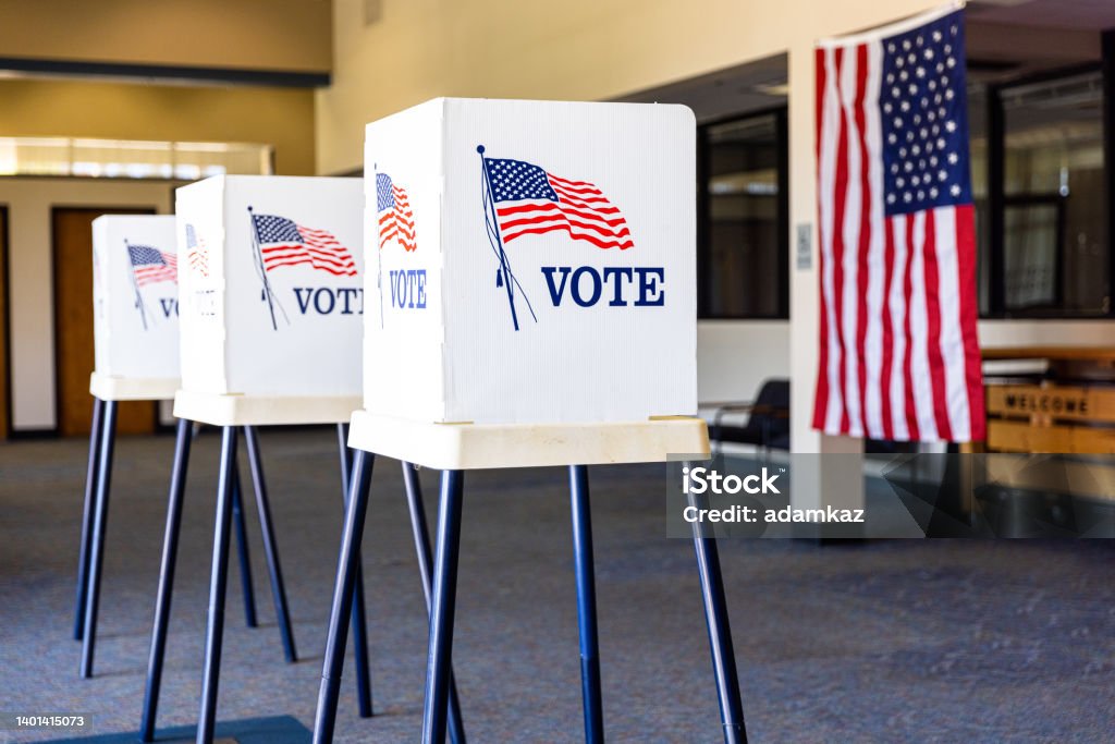 Empty Voting Booths On Election Day Voting Booths set up in rows on Election Day Midterm Election Stock Photo
