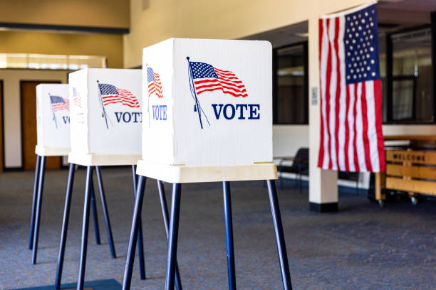 Empty Voting Booths On Election Day Voting Booths set up in rows on Election Day midterm election stock pictures, royalty-free photos & images