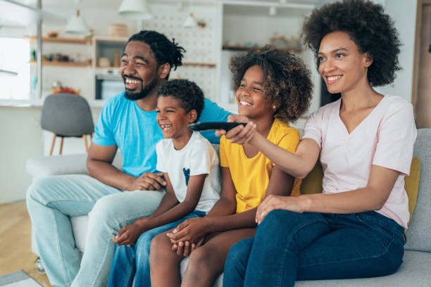 istock Family watching television 1401416460