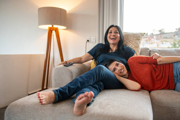 istock Lesbian couple watching TV 1401417888