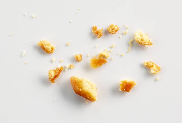 bread crumbs on white background bread crumbs macro on white background, top view mini wheat cereal stock pictures, royalty-free photos & images