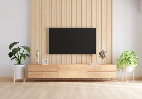 Widescreen TV and wood sideboard in living room interior, 3D rendering