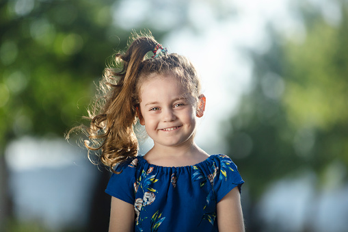 portrait of a happy little girl with a beautiful smile