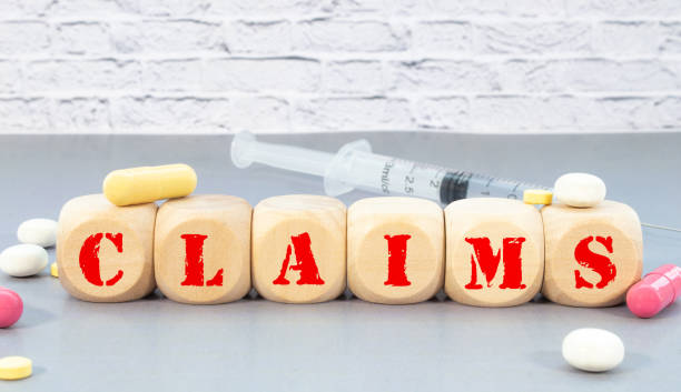 istock Claims Word In Wooden Cube, madical concept 1401422807