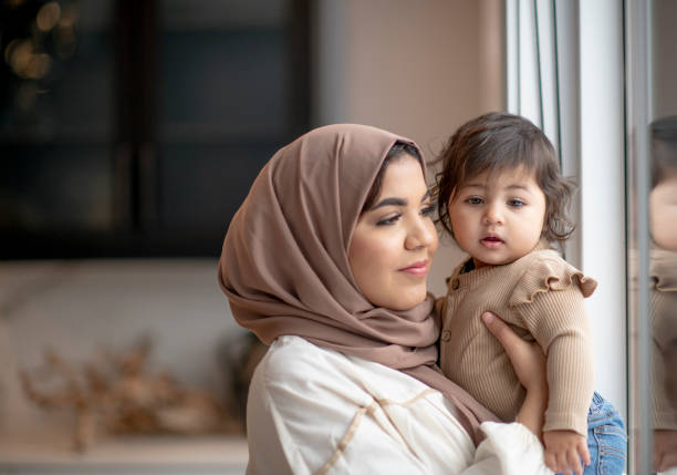 istock Looking Out the Window with Mommy 1401424551