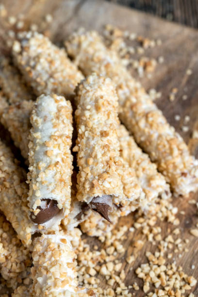 istock waffle tube with chocolate filling and crushed peanuts 1401424940