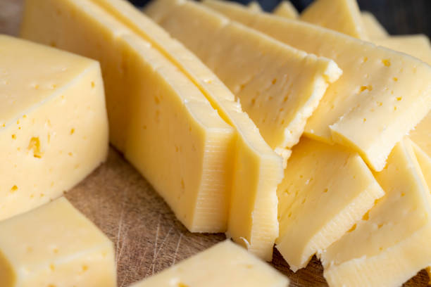 istock fresh yellow milk cheese on a board 1401425174