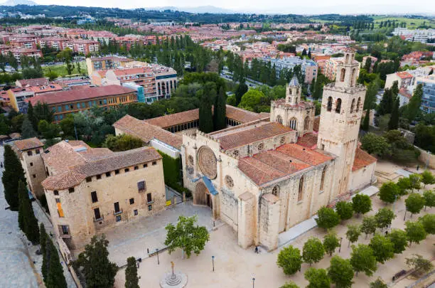 View from drone of ancient Benedictine abbey in Sant Cugat del Valles, Catalonia, Spain
