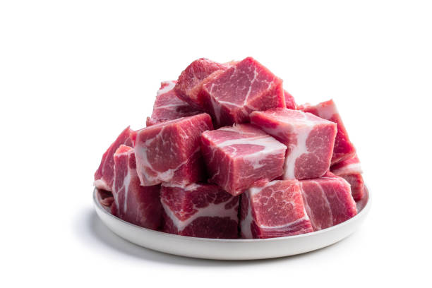 istock Fresh raw pork in ceramic plate isolated on white 1401427081