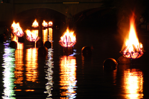 The Waterfire in Providence Rhode Island are a series of bonfires lit just above the Woonasquatucket River and is reflected in the waters