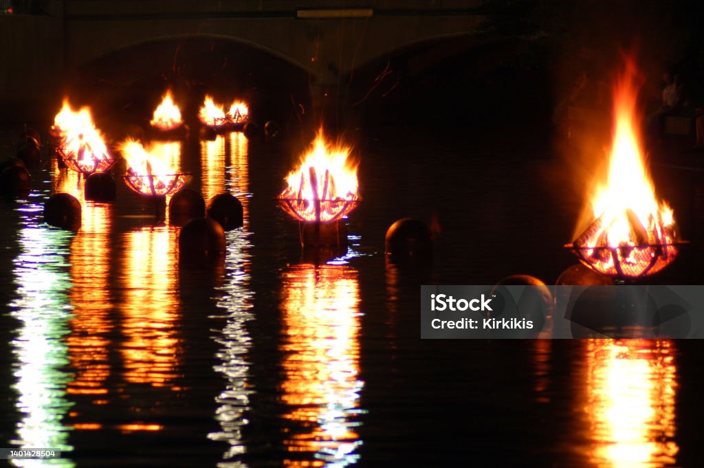 Bonfires of Waterfire The Waterfire in Providence Rhode Island are a series of bonfires lit just above the Woonasquatucket River and is reflected in the waters Providence - Rhode Island Stock Photo