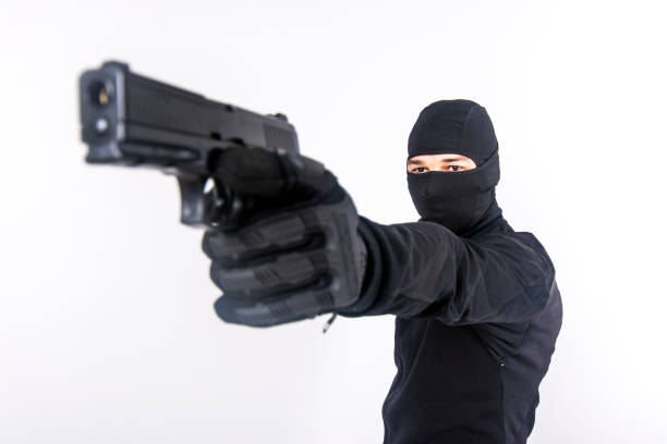 istock Gunman about to shoot with a gun 1401429223