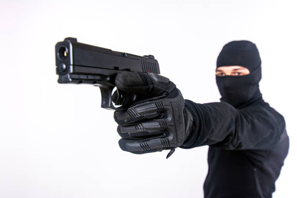 istock Gunman about to shoot with a gun 1401429270