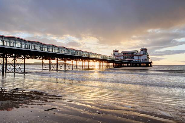Sunset at the Pier in Westin Super-mare Taken from the beach at Weston Super-mare estuary photos stock pictures, royalty-free photos & images