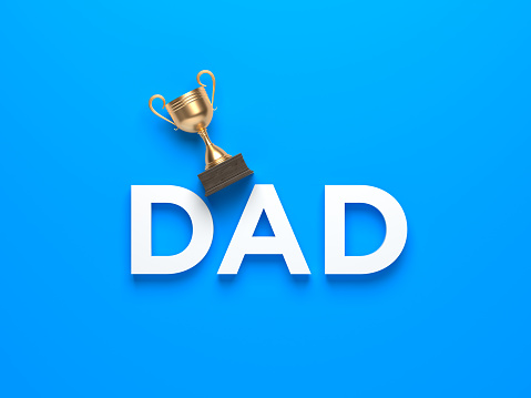 Golden award cup and dad text father's day concept on blue color background. Horizontal composition isolated with clipping path.