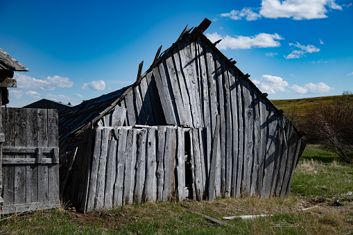 100+ year old wooden board barn on Montana homestead ranch in northwestern USA.