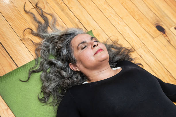 istock Active, mature, body positive hispanic woman in exercise class 1401433666