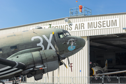 Palm Springs Airport, CA, USA - March 25, 2021: image of Douglas C-47 Skytrain military transport plane with registration N60154 shown at the Palm Springs Air Museum in Riverside County.