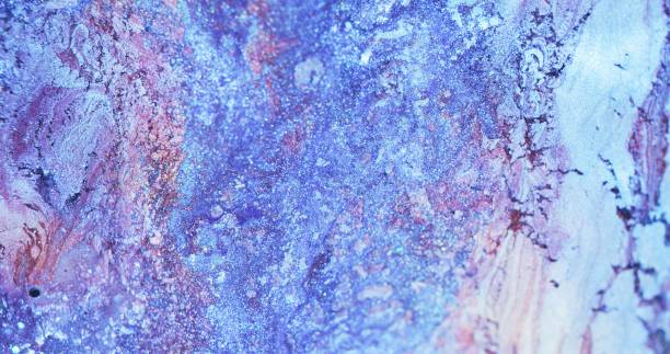 istock glitter ink background dye mix blue pink flecks 1401437046