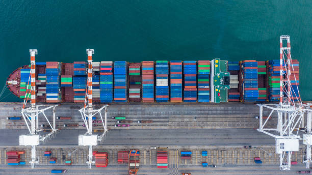 istock Aerial view container ship working at seaport, Global business company import export logistic and transportation of international global trading by container cargo freight shipping cargo vessel. 1401437759