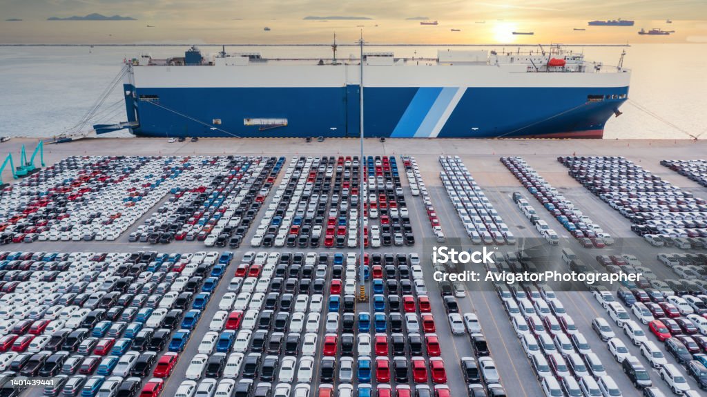 Aerial view vehicle carrier vessel loading car for shipping to worldwide, Large RoRo (Roll on/off) vehicle car carrier, New car lined up in the port for import export around the world. Car Stock Photo