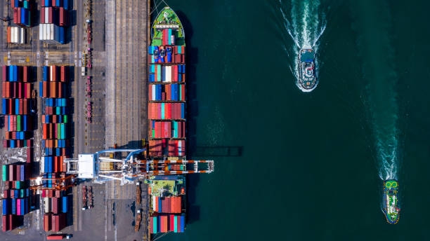 istock Container ship carrying container box in import export to commercial port, Global business cargo freight shipping commercial trade logistic and transportation oversea worldwide by container vessel. 1401440042