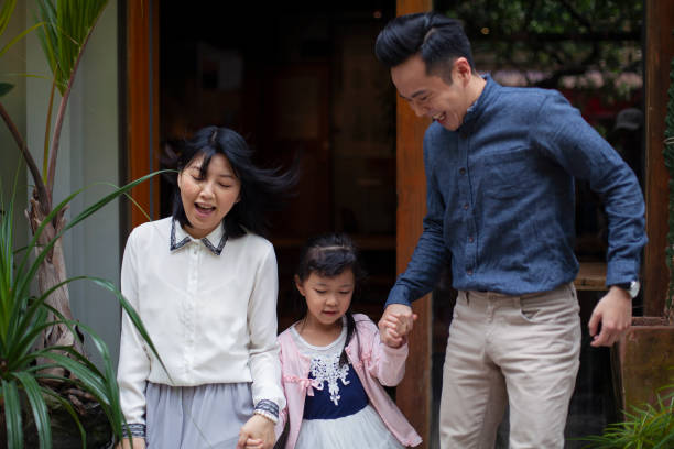 istock Asian Family Portrait in Front Yard 1401440202