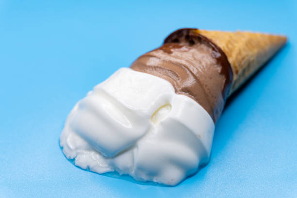 istock angle view melting flower shape cocoa flavor ice cream cone on a blue background 1401442376
