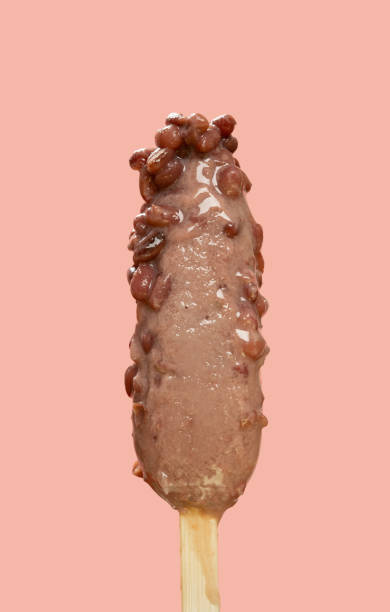 istock half melting red bean popsicle on pink background 1401442394