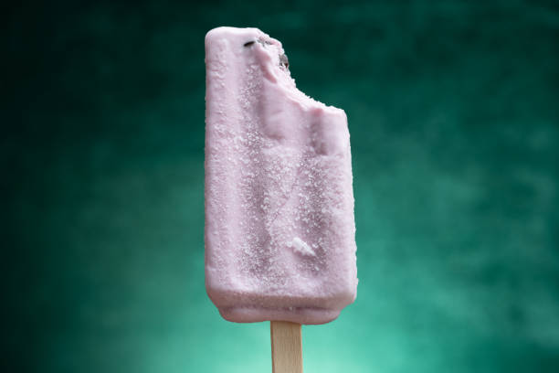 istock sweet potato flavor popsicle with tapioca with a bite on a gradient green background 1401442690