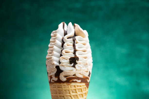 istock vanilla and chocolate flavor ice cream cone on a gradient green background 1401442696