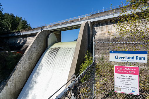 North Vancouver, BC, Canada - April 19 2021 : Capilano Lake Cleveland Dam. Capilano River Regional Park.