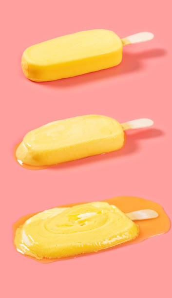 istock yellow popsicle in a melting process on pink background 1401443524