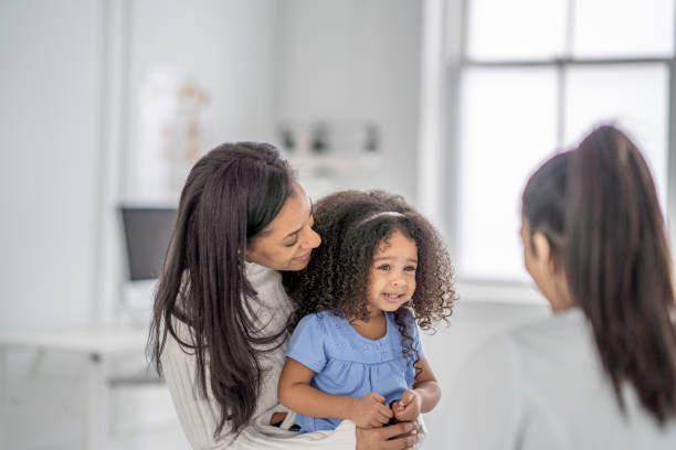 istock Mother and Daughter at the Doctors 1401449325