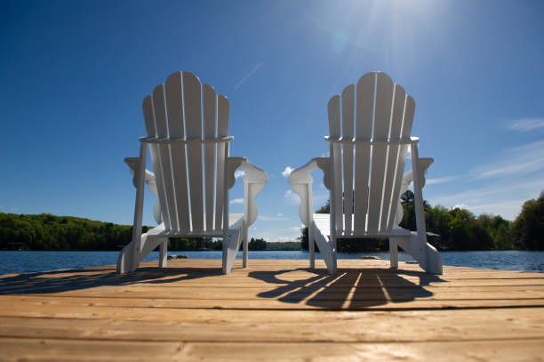 istock Low angle capture of two white Adirondack chair 1401452636