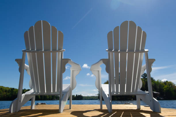 istock Low angle capture of two white Adirondack chair 1401452638