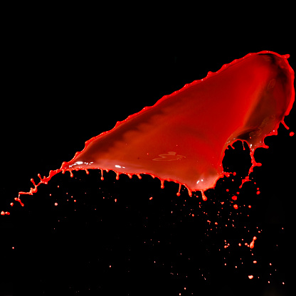 isolated red paint against black backgrounds