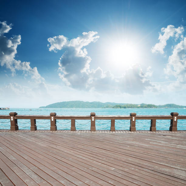 travel and vacation concept - wooden bridge, sea, summer, vacation, happy time