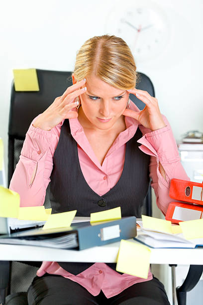 istock Tired business woman sitting at workplace overwhelmed with sticky notes 140145492