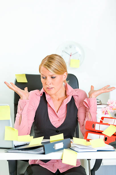 istock Shocked business woman sitting at workplace covered with sticky notes 140145499