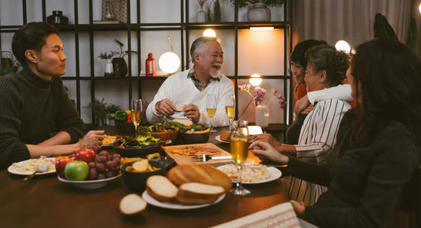istock Asian family having dinner at dining table at home 1401456859
