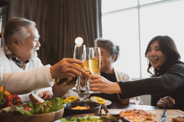 istock Asian family having dinner at dining table at home 1401456867