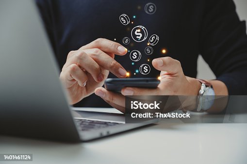 istock Hand of businessman using smart phone with coin icon. 1401461124